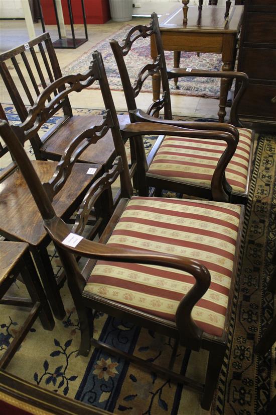 Pair of George III style mahogany ladderback elbow chairs